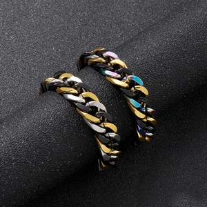 Titanium steel cuban chain rings in gold black and silver finishes on display