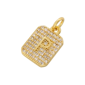 Detailed view of luxury gold square pendant with cubic zirconia and letter P detail