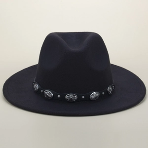 Detail view of the black felt fedora with vintage silver metal oval pattern studs on the band