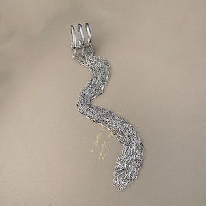 Elegant silver triple layer long tassel ear cuffs with wave fringe on beige leather