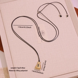 Detail view of gold money bag pendant necklace with dimensions 110cm cord and 2cm charm