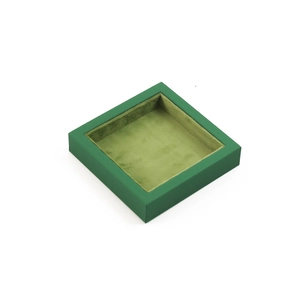 Square green velvet jewelry organizer tray for necklace and ring storage on white background