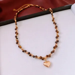 18k gold plated tiger eye beaded necklace with heart pendant and radiant sunburst carving