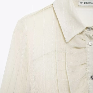 Elegant off-white French style chiffon blouse with ruffle collar and vertical texture details