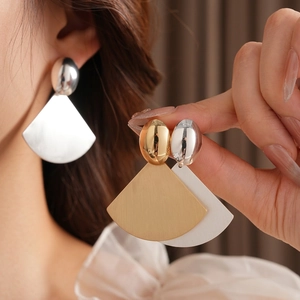 Brushed metal fan-shaped earrings in gold and silver, geometric statement jewelry