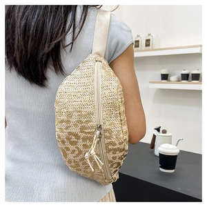 Rear view of a model wearing the woven oxford fabric waist bag in a minimalist room