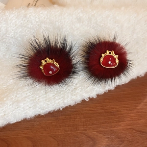 Elegant burgundy plush stud earrings with gold Ruyi lock charm and crystal on white fur