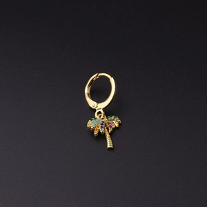 Detail of gold palm tree hoop earring with vibrant multicolored zircon gemstone inlay