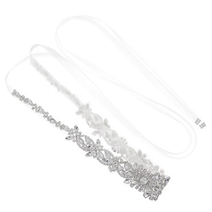 Detailed close-up of crystal and pearl bridal belt with silver floral rhinestone applique