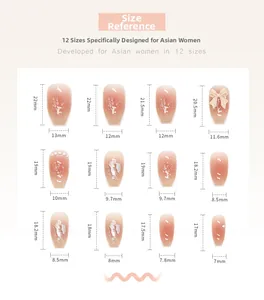 Detailed size chart for pink gradient press-on nails with bow and pearl decorations