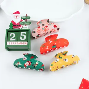 Christmas hair claw clip set with Santa and reindeer patterns in four festive colors