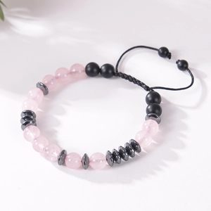 Detailed shot of handmade Morse code bracelet with pink crystal beads and black matte stone