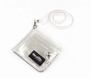 Close-up of glitter transparent PVC card holder with silver snap and detachable neck strap