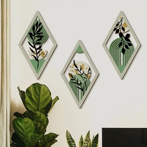 3-piece set of bohemian wooden geometric wall art with green botanical leaf motifs