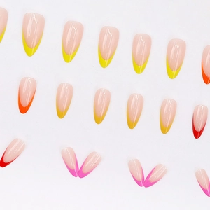 Colorful almond-shaped French tip press-on nails with neon yellow, orange and pink tips