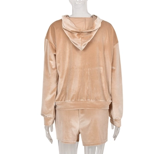 Back view of velvet tracksuit set with hooded sweatshirt and matching shorts in champagne gold