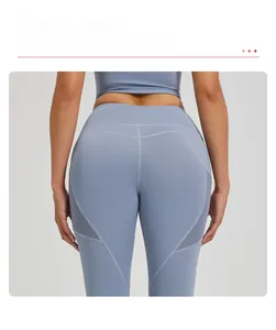 Detail of high waist yoga pants with peach butt lifting seams and mesh panels
