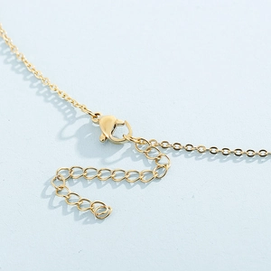 Detailed close-up of 18k gold-plated lobster clasp and adjustable extension chain on necklace