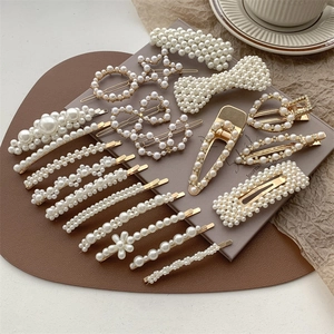 Elegant 15-piece pearl hair clip set with gold metal bases in various geometric shapes