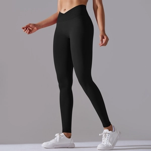 Detail view of high waist crossover V-cut design on black seamless yoga leggings