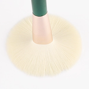 9-piece dark green makeup brush set featuring large fan brush with soft synthetic bristles