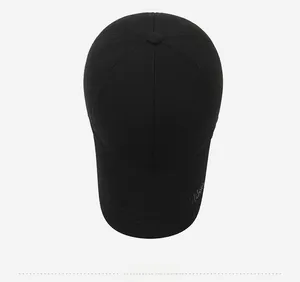 Top down view of black wool baseball cap with grey embroidery and six-panel structure