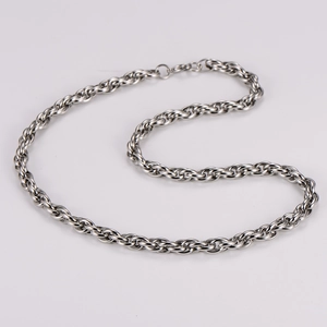 Macro detail of the silver braided rope texture on this stainless steel twist chain