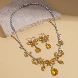 Vintage palace style jewelry set with yellow teardrop crystals and butterfly necklace