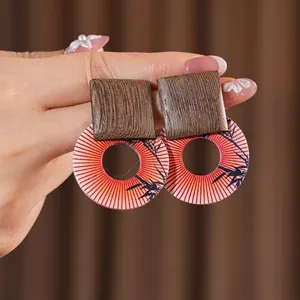 Geometric wood and resin printed drop earrings with vintage bamboo leaf pattern