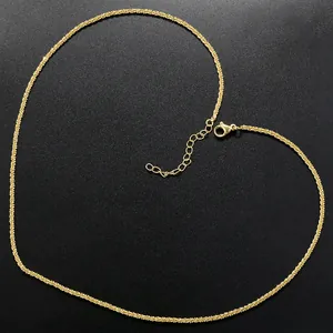 Close-up of heart-shaped gold water ripple chain necklace with lobster clasp and extender