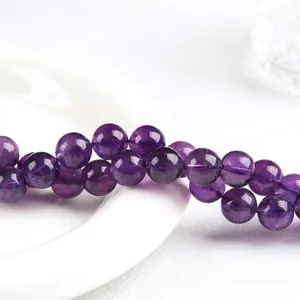 Polished Uruguay natural amethyst round beads with purple transparency and texture