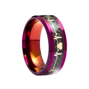 Macro detail of men's titanium ring with purple edges and carbon fiber heartbeat design