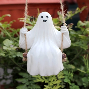 Ghost on a wooden swing hanging decoration for outdoor garden and Halloween decor
