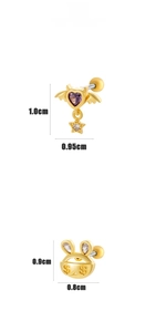 Detail of heart with purple zircon and rabbit stud earrings on a white background