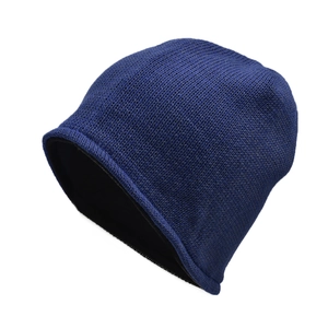 Close-up of deep blue winter beanie showing the warm thick fleece lining and knit texture