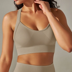 Close-up of khaki seamless ribbed sports bra texture with wide supportive underband