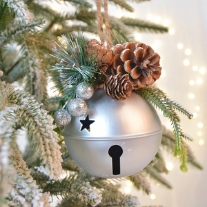 Matte silver Christmas bell ornament with natural pine cones and silver glitter berries