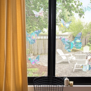 Rainbow laser butterfly window stickers showing prism effects for bird strike prevention