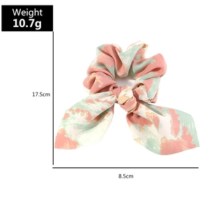 Floral bow scrunchie dimensions 17.5cm by 8.5cm shown with 10.7g weight on white background