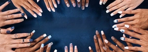 Detailed showcase of diverse long French press-on nails featuring black tips and rhinestones