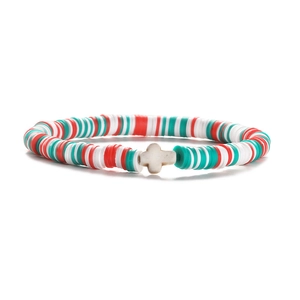Detail of red, white and green heishi clay beads bracelet with a white cross charm