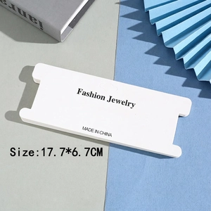 Macro detail of white I-shaped jewelry display card with Fashion Jewelry text