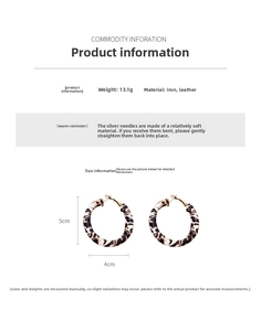Detail shot of leopard print leather hoop earrings with silver needles and size specs