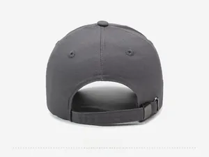 Detail view of the adjustable metal buckle and cotton fabric strap on back of baseball cap