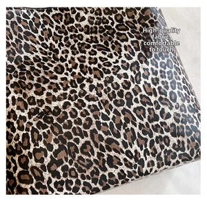 Detailed close-up showing the leopard print pattern and premium texture of this shoulder bag