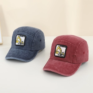Detail of kids denim baseball caps with excavator embroidery in navy and burgundy