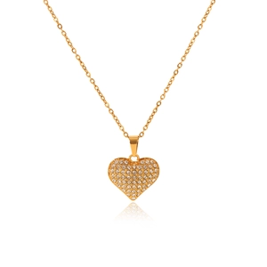 Detailed view of a golden heart pendant with shimmering rhinestones on a slim chain