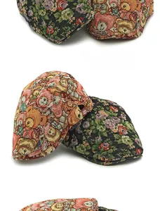 Detail of vintage jacquard beret featuring colorful floral and cartoon bear patterns