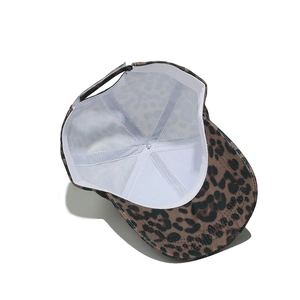Close-up of leopard print baseball cap interior with reinforced seams and adjustable strap