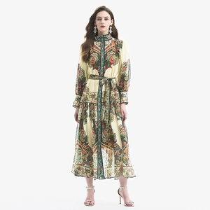 Bohemian paisley print maxi dress with lantern sleeves and ruffled hem on white background